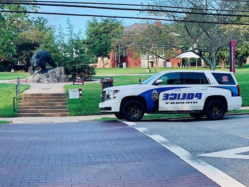 A police vehicle sits on campus. 